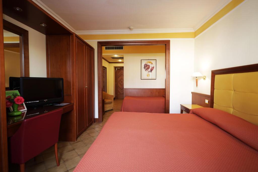 Postel nebo postele na pokoji v ubytování Hotel Il Chiostro by LVG Hotel Collection
