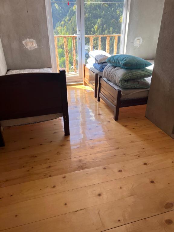Postel nebo postele na pokoji v ubytování Lento Kaldani Guesthouse