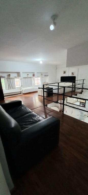 a living room with a couch and a table at Piran Loft in Buenos Aires