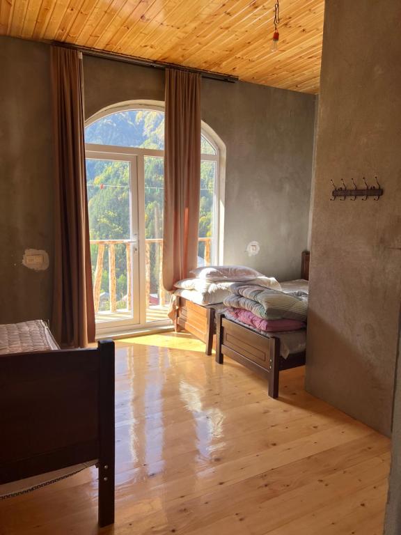 Postel nebo postele na pokoji v ubytování Lento Kaldani Guesthouse