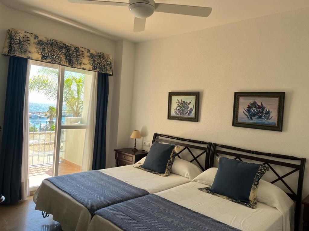 Posteľ alebo postele v izbe v ubytovaní Lyrioshomes Precioso Apartamento Puerto de Estepona