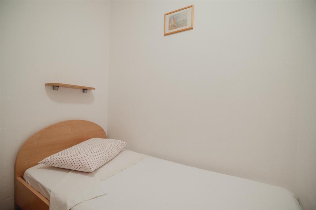 Postel nebo postele na pokoji v ubytování Apartments Antun