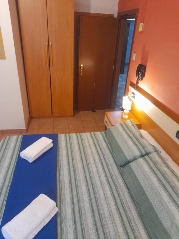 Postel nebo postele na pokoji v ubytování Hotel Amba Alagi