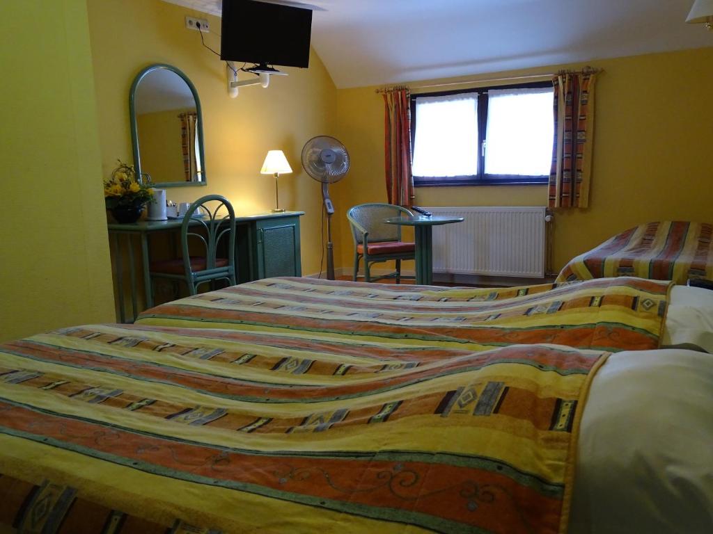 Postel nebo postele na pokoji v ubytování Hotel Le Relais de Pommard