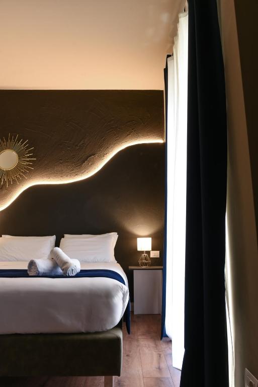 Posteľ alebo postele v izbe v ubytovaní Il Corso Comfort Rooms