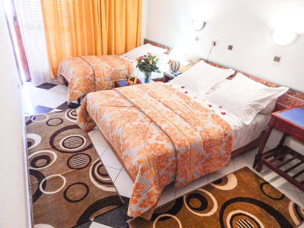 Postel nebo postele na pokoji v ubytování Hotel Sindibad