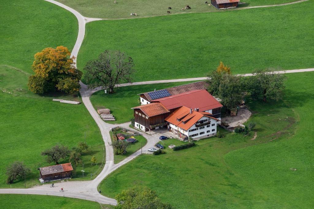 an aerial view of a house in a field at Ferienapartment Brandstatt in Seeg