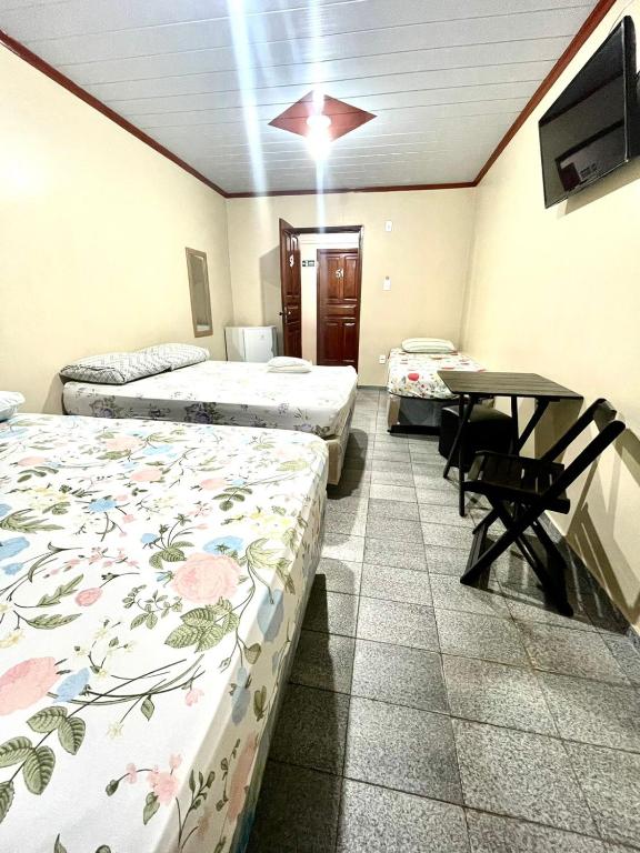 Postel nebo postele na pokoji v ubytování Hotel Fortaleza Manaus