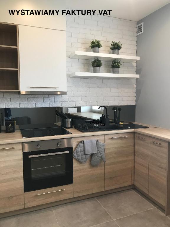 Kuchyňa alebo kuchynka v ubytovaní Apartament SZTOKHOLM