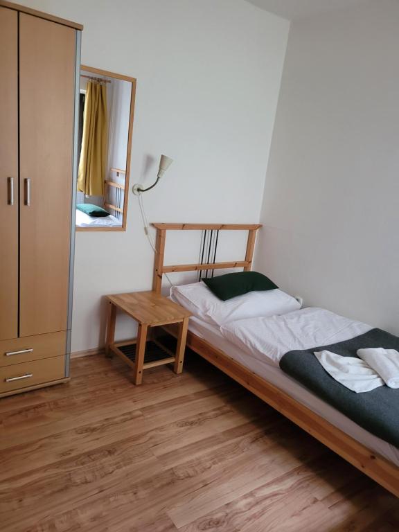 A bed or beds in a room at Penzion Klopacka