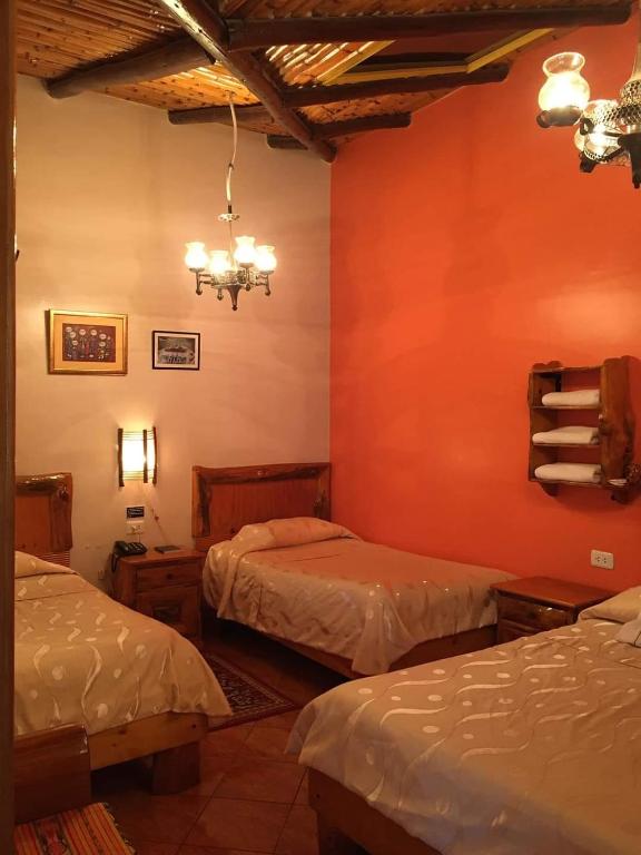 Postel nebo postele na pokoji v ubytování HOTEL El INDIO