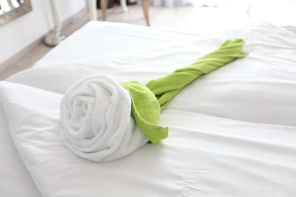 Postel nebo postele na pokoji v ubytování Hotel Diana Garni