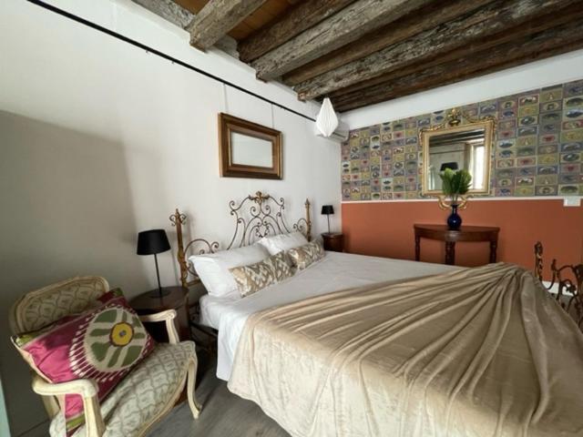 A bed or beds in a room at Arena al Palio