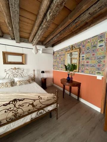 A bed or beds in a room at Arena al Palio