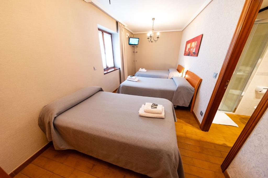 A bed or beds in a room at CASA RURAL BARAZAR