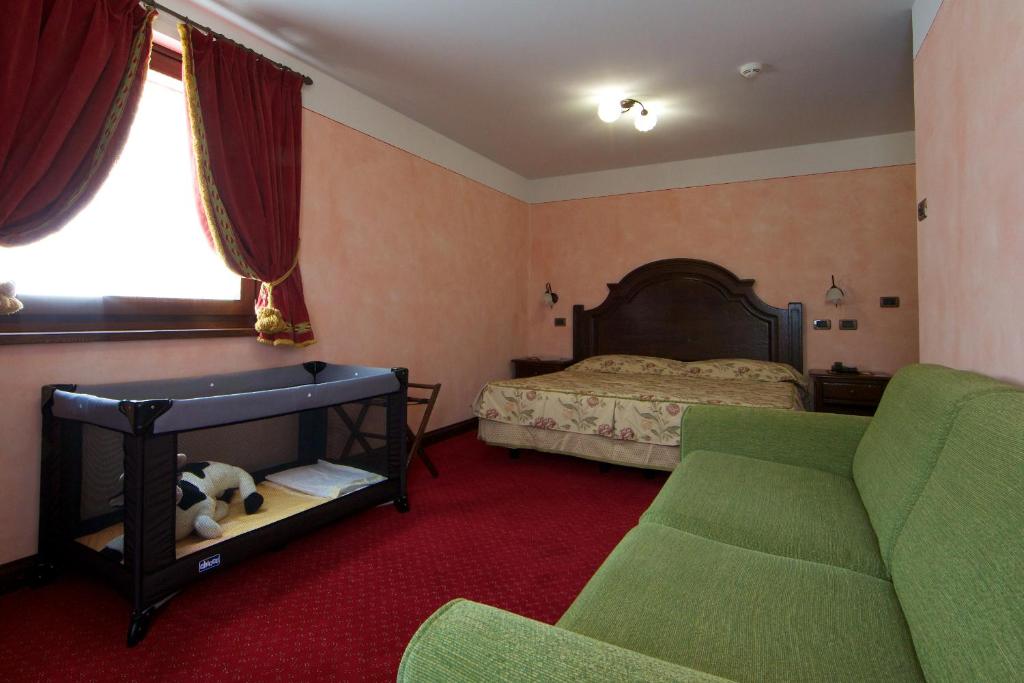 Postel nebo postele na pokoji v ubytování Hotel L' Aiglon
