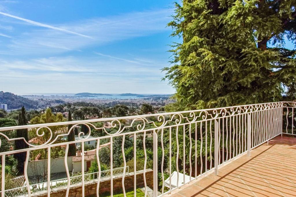 a balcony with a view of the city at Maison du Baou - Welkeys in Toulon