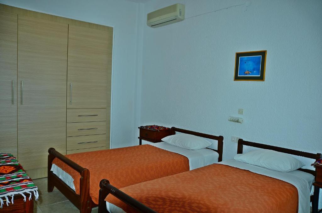 Posteľ alebo postele v izbe v ubytovaní Poppy Villas