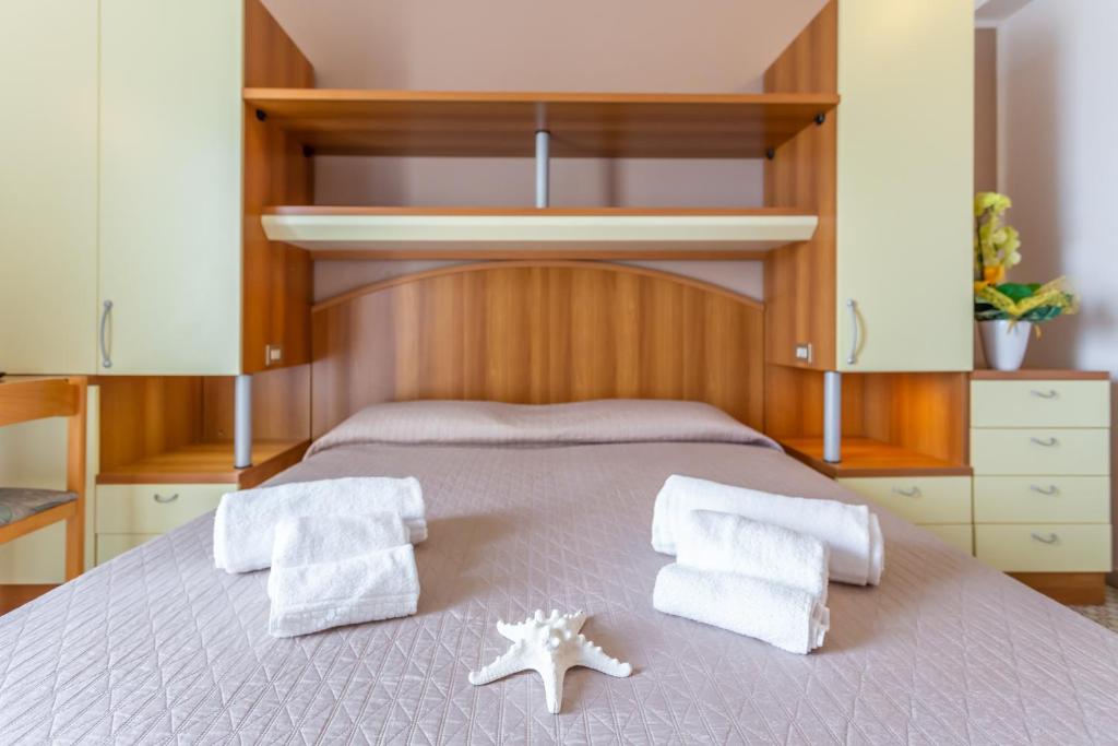 Postel nebo postele na pokoji v ubytování Hotel Ideale Mare