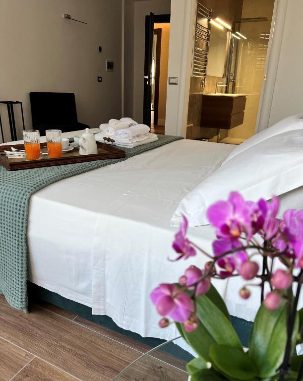 Postel nebo postele na pokoji v ubytování Alèa Rooms