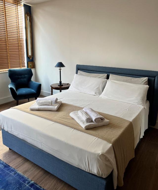 Postel nebo postele na pokoji v ubytování Alèa Rooms