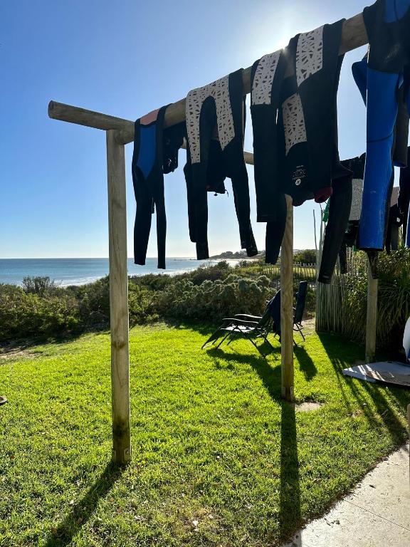 a clothes line with a blanket on the beach at Witbaai Beach House in Britannia Bay