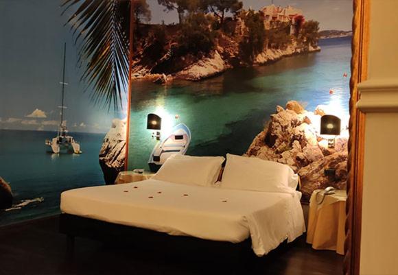 a bedroom with a bed and a view of the water at Hotel Don Carlo in Broni
