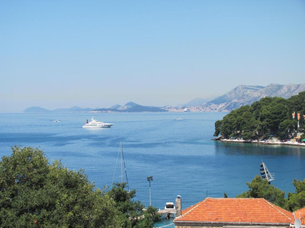 a boat in a large body of water at Guesthouse Marija in Cavtat