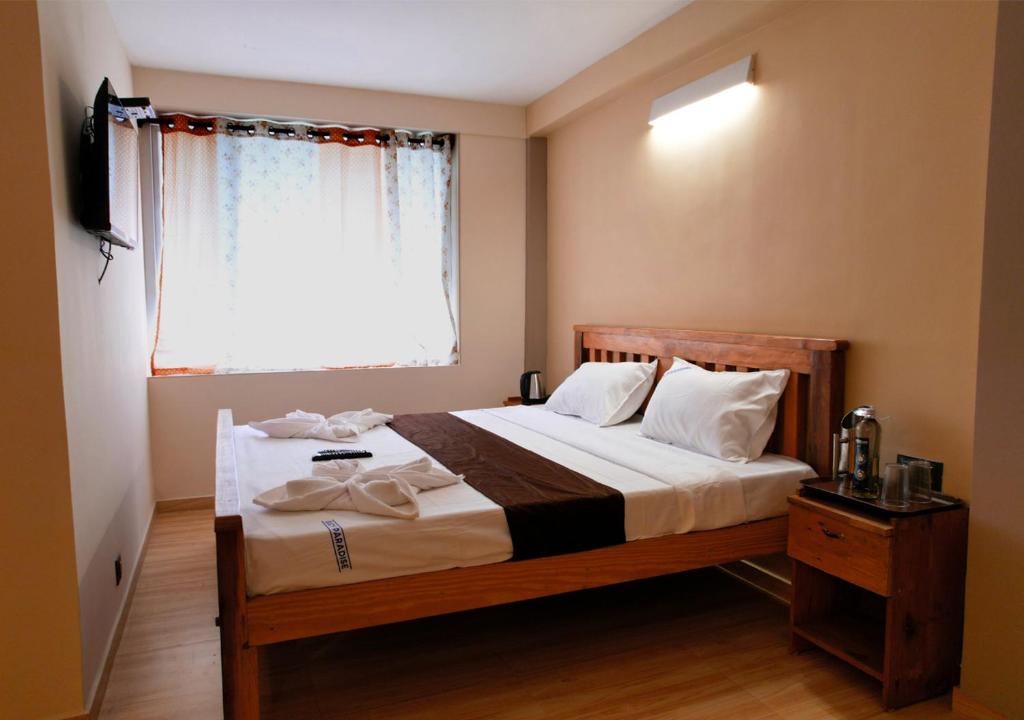 Postel nebo postele na pokoji v ubytování Lazo Eucy Paradise ,Kodaikanal