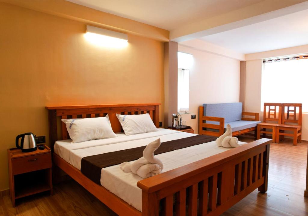Postel nebo postele na pokoji v ubytování Lazo Eucy Paradise ,Kodaikanal