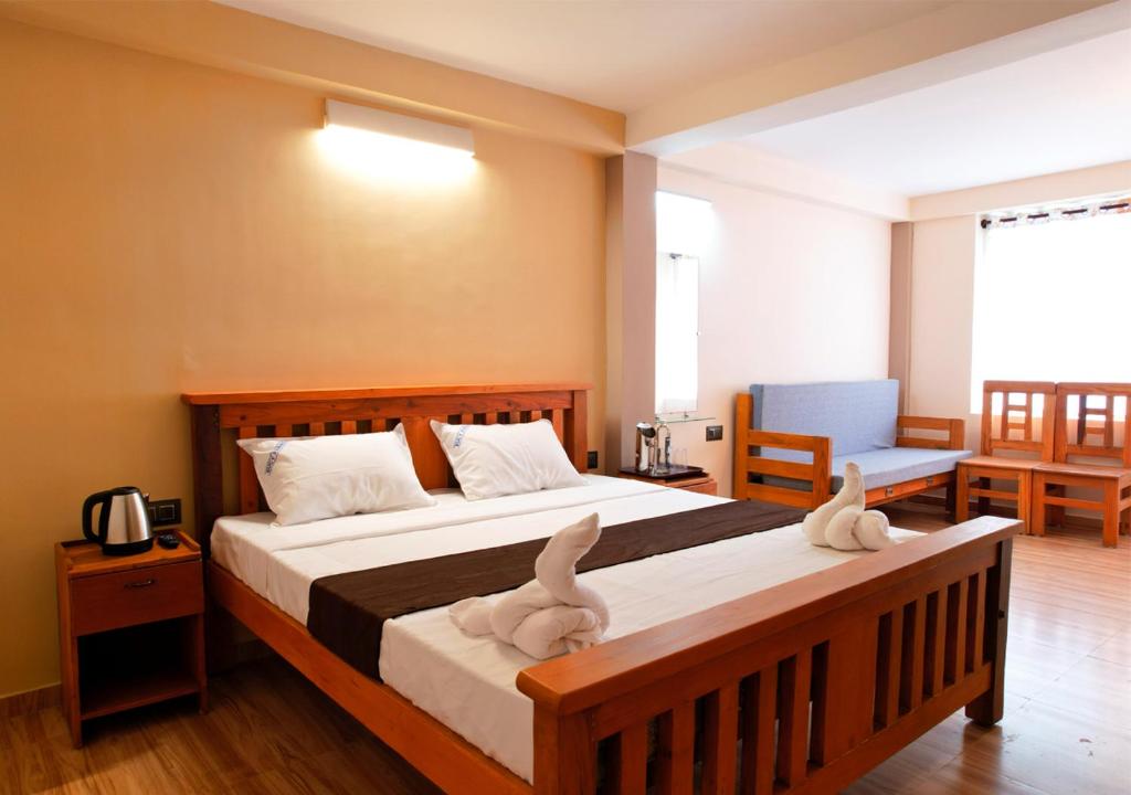 Postel nebo postele na pokoji v ubytování Lazo Eucy Paradise ,Kodaikanal