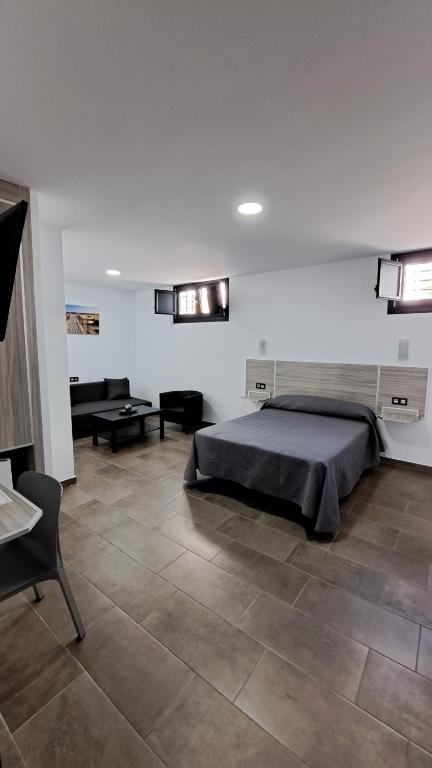 Posteľ alebo postele v izbe v ubytovaní Hostal Maria Jose