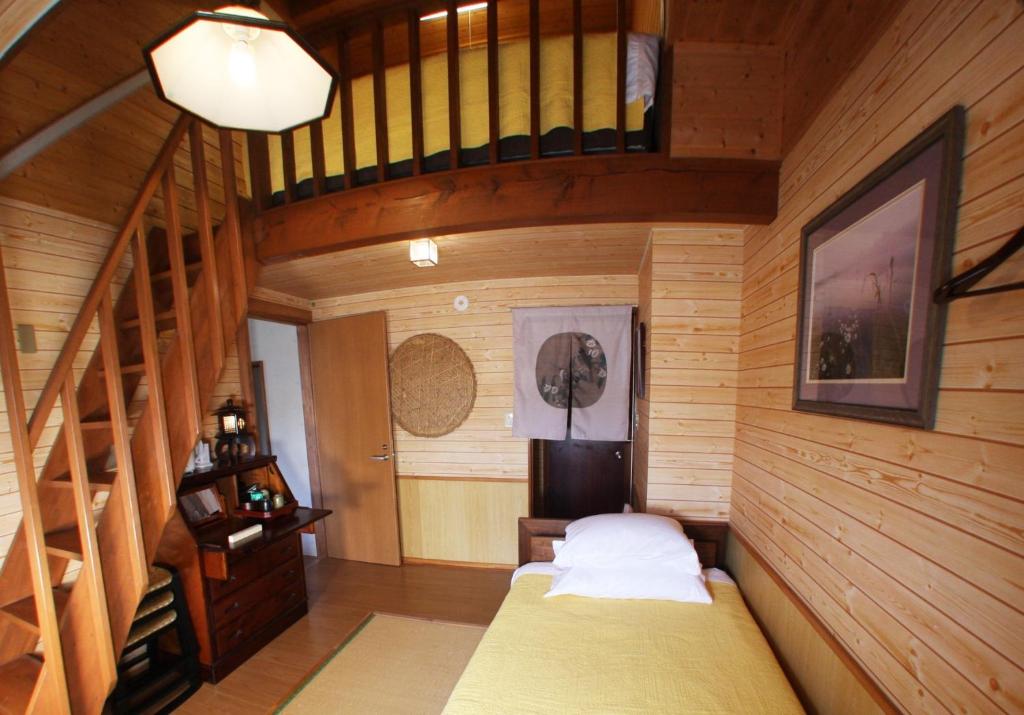 a small room with a bed and a staircase at Nikko - House - Vacation STAY 96256v in Nikko