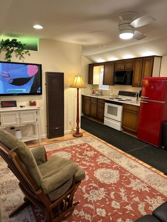 a large kitchen with a red refrigerator and a chair at NEW Private House B with Carports EV Plugin L2 in Twin Falls