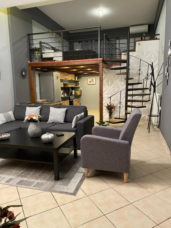 a living room with a couch and a table at Felicia`s House in Agria