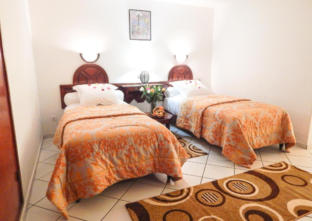 Postel nebo postele na pokoji v ubytování Hotel Sindibad