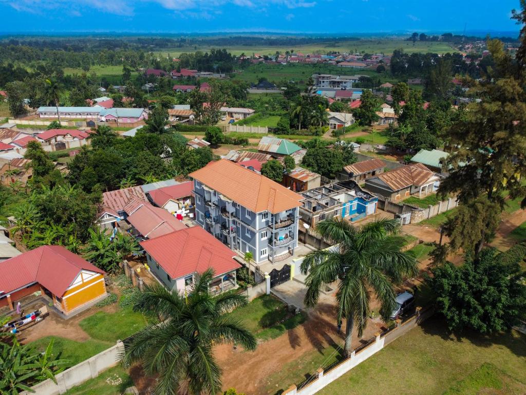 an aerial view of a resort complex with palm trees at Frankfurt Cottages in Mbale