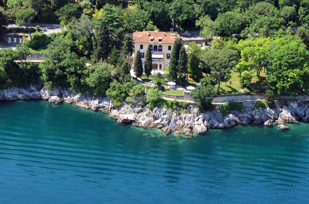 an aerial view of a house on the shore of a river at Villa Ariston in Opatija