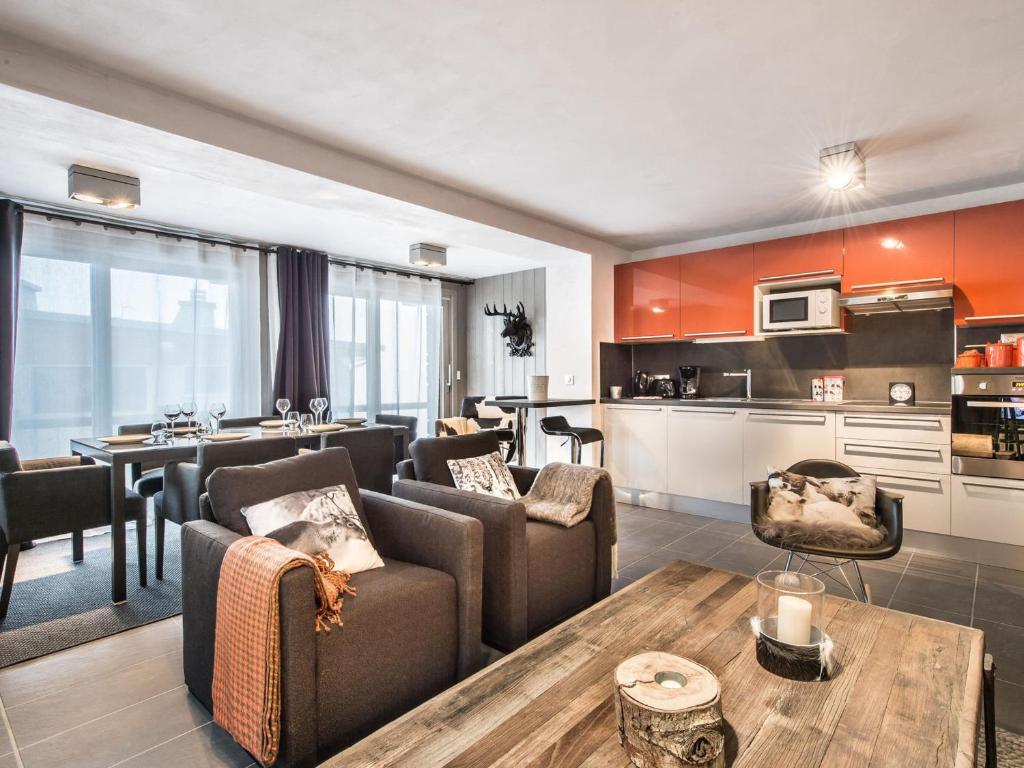 a living room with a couch and a table at Appartement Courchevel 1650, 3 pièces, 6 personnes - FR-1-563-8 in Courchevel