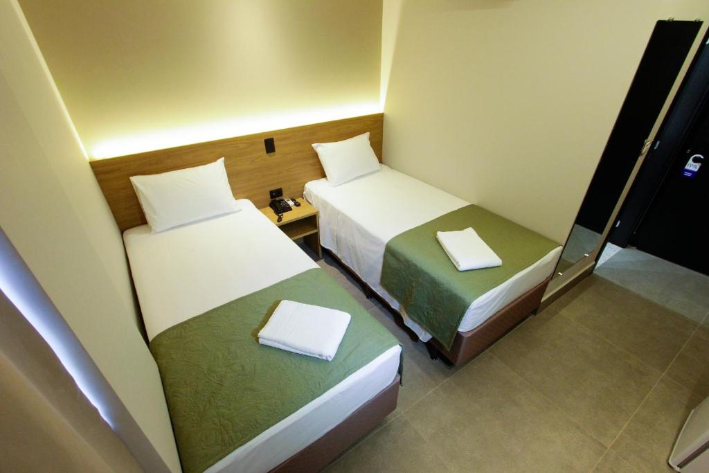 Postel nebo postele na pokoji v ubytování NEO PARK HOTEL