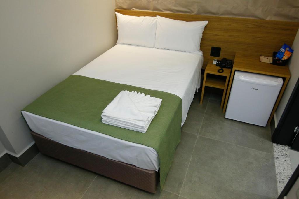 Postel nebo postele na pokoji v ubytování NEO PARK HOTEL