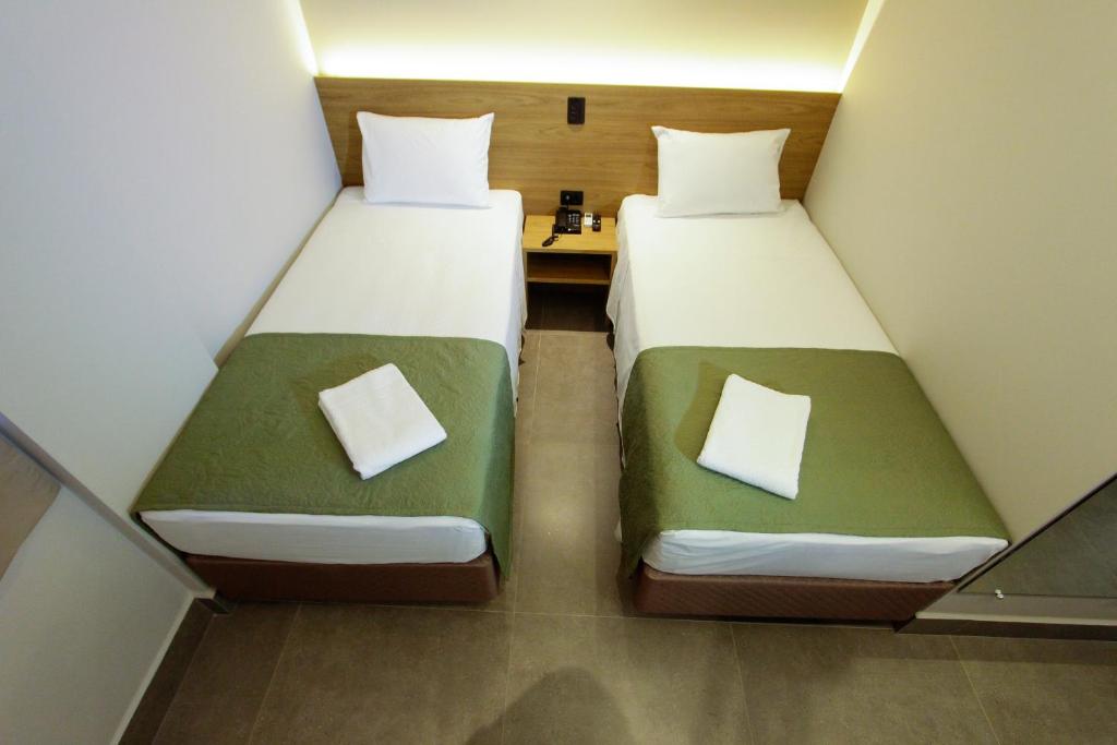 Postel nebo postele na pokoji v ubytování NEO PARK HOTEL