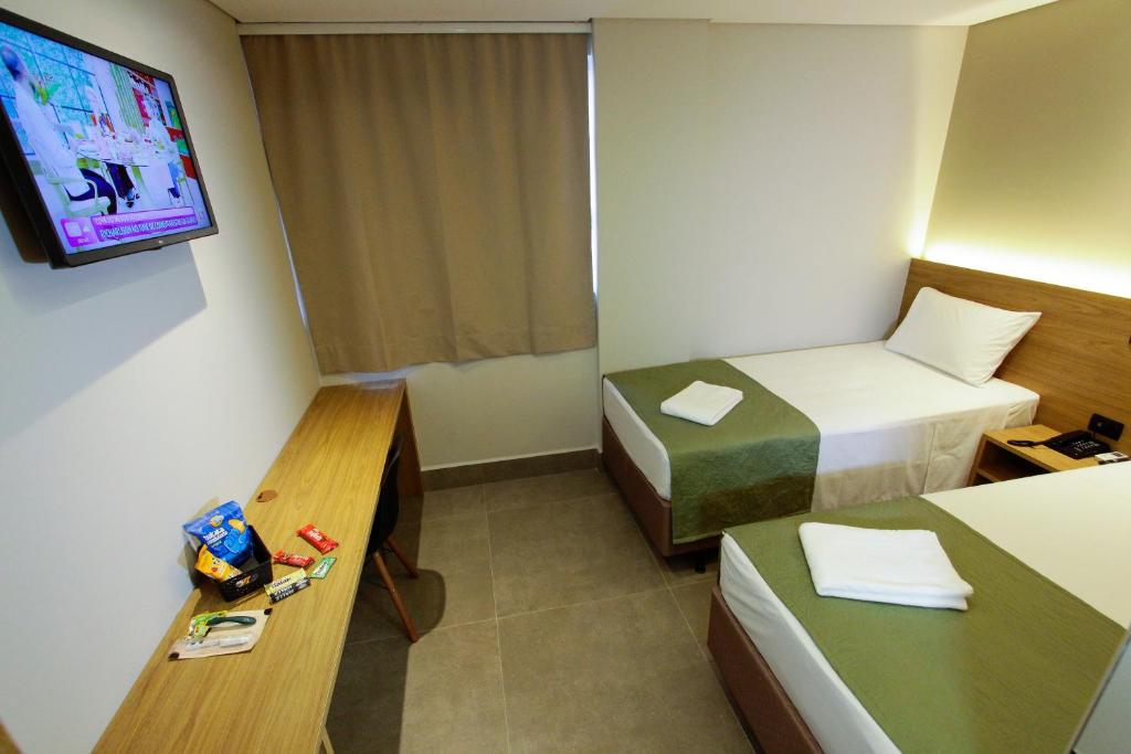 Postel nebo postele na pokoji v ubytování NEO PARK HOTEL
