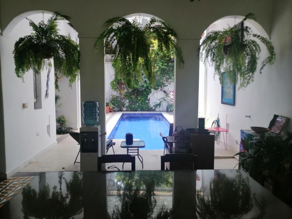 a living room with a swimming pool in a house at Casa Paraiso in Honda