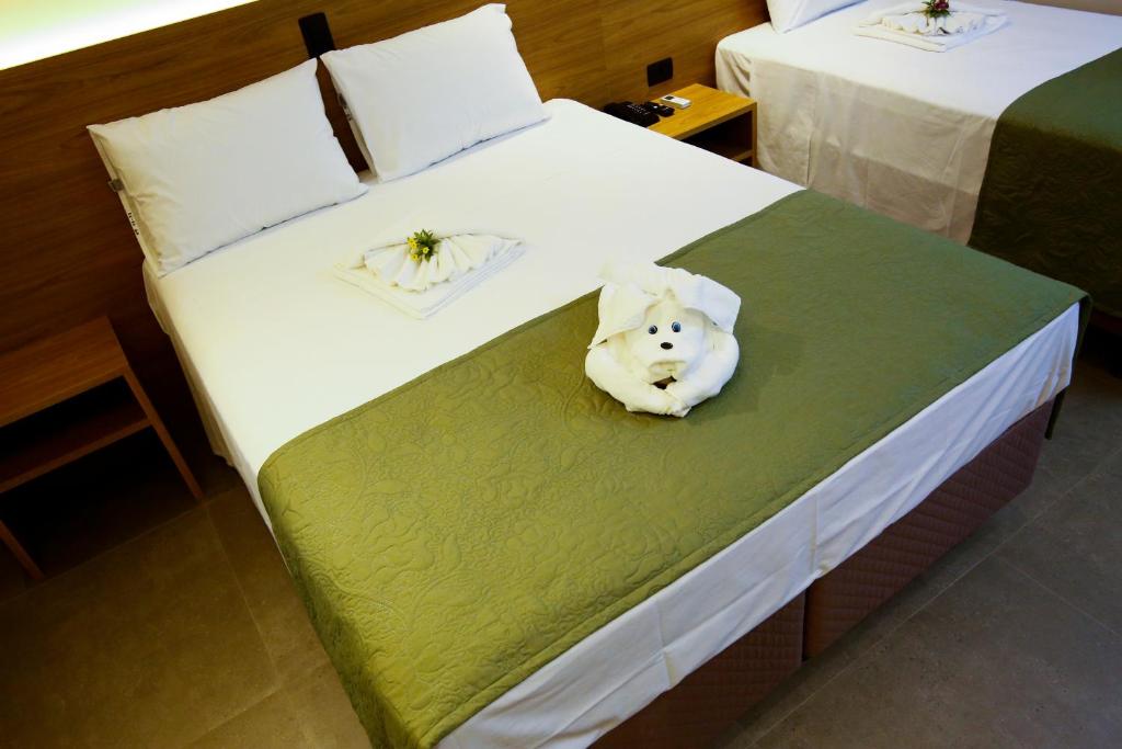 Postel nebo postele na pokoji v ubytování NEO PARK HOTEL