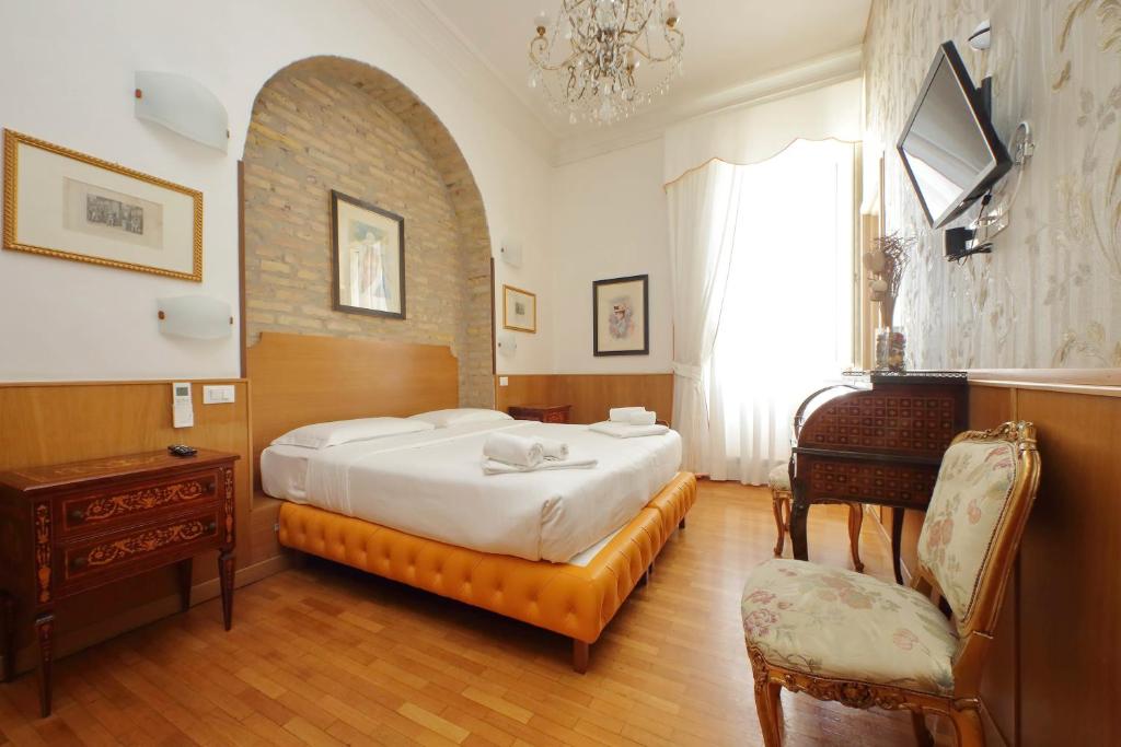 Postel nebo postele na pokoji v ubytování Sonnino Suite