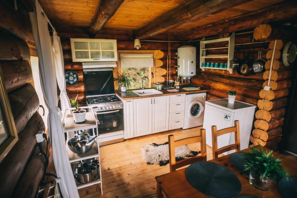 an aerial view of a kitchen in a log cabin at Heaven Treehouse - ADULT ONLY RESORT, SELF CHECK IN in Peşteana