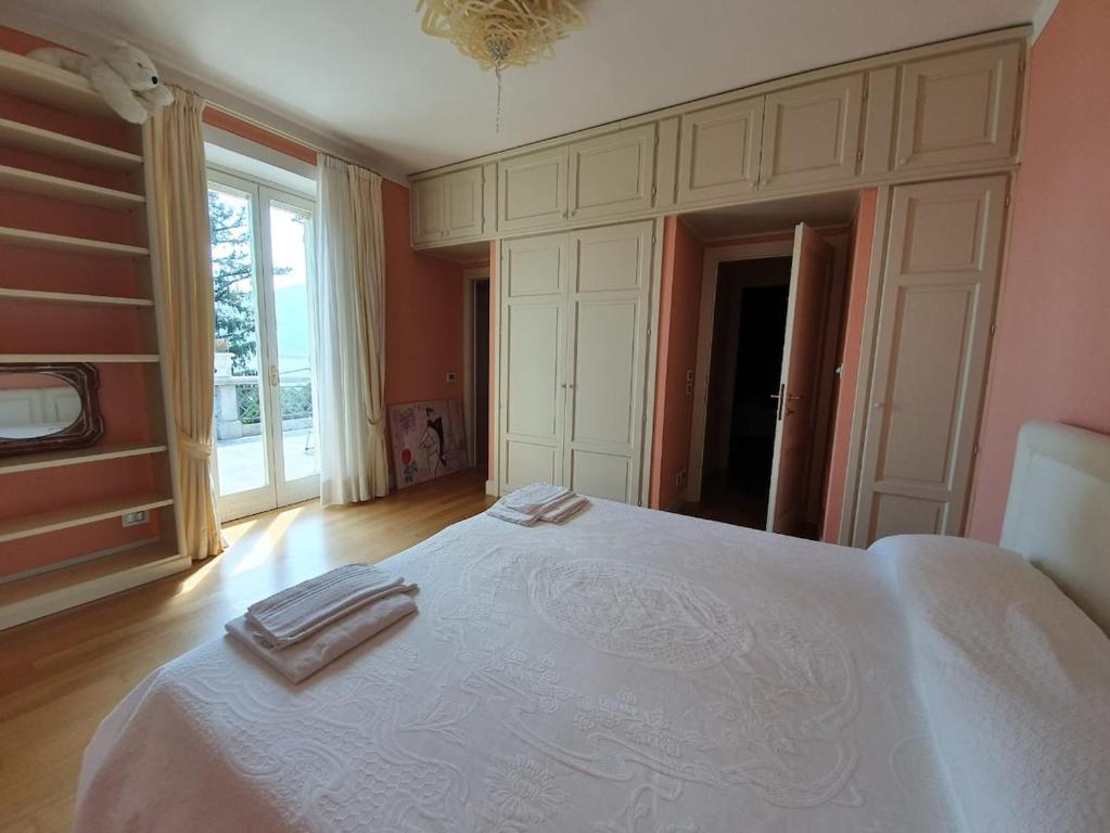 Łóżko lub łóżka w pokoju w obiekcie Villa Rita
