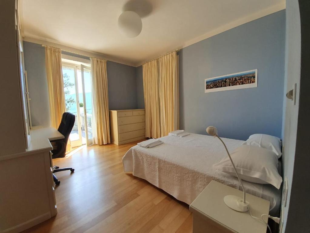 Łóżko lub łóżka w pokoju w obiekcie Villa Rita