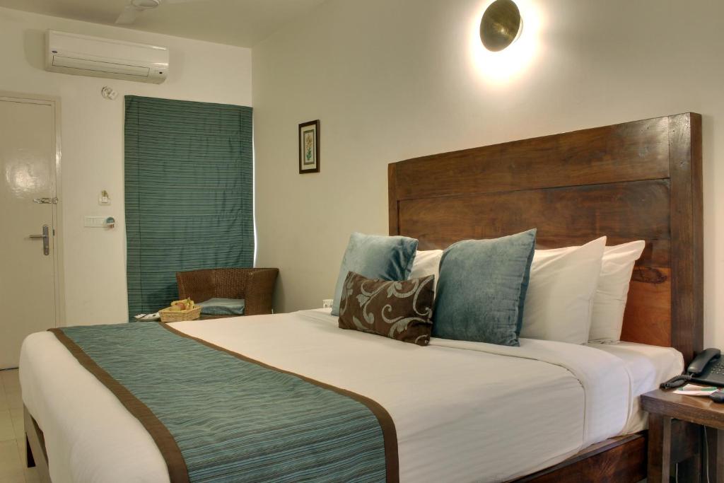 A bed or beds in a room at Devraj Niwas